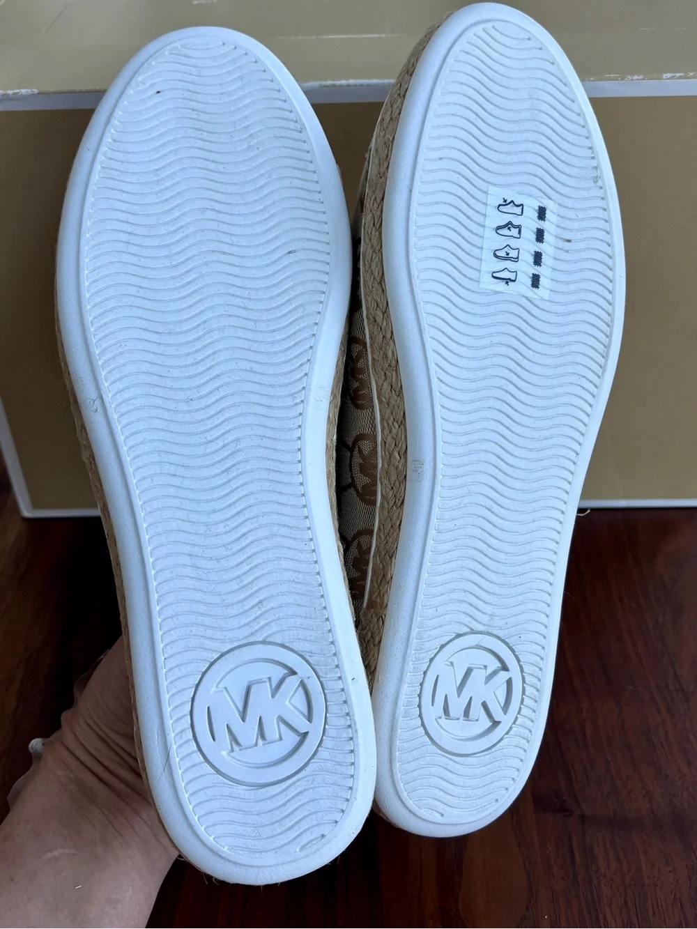 Brand New pair of Michael Kors Kristy Slide Sneakers in a cream and beige, 6.5.